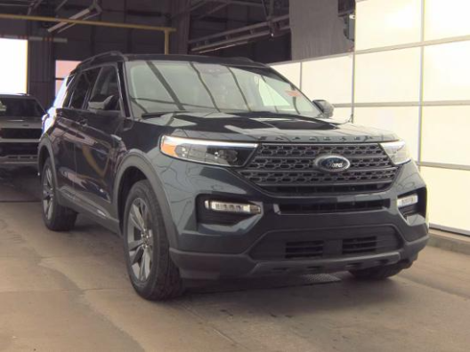 2023 Ford Explorer XLT in Blue Metallic — front three-quarter view