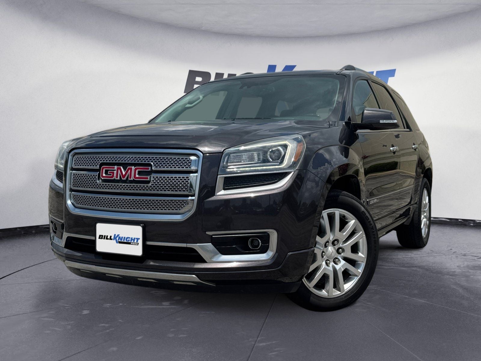 2015 GMC Acadia Denali in Iridium Metallic — front three-quarter view