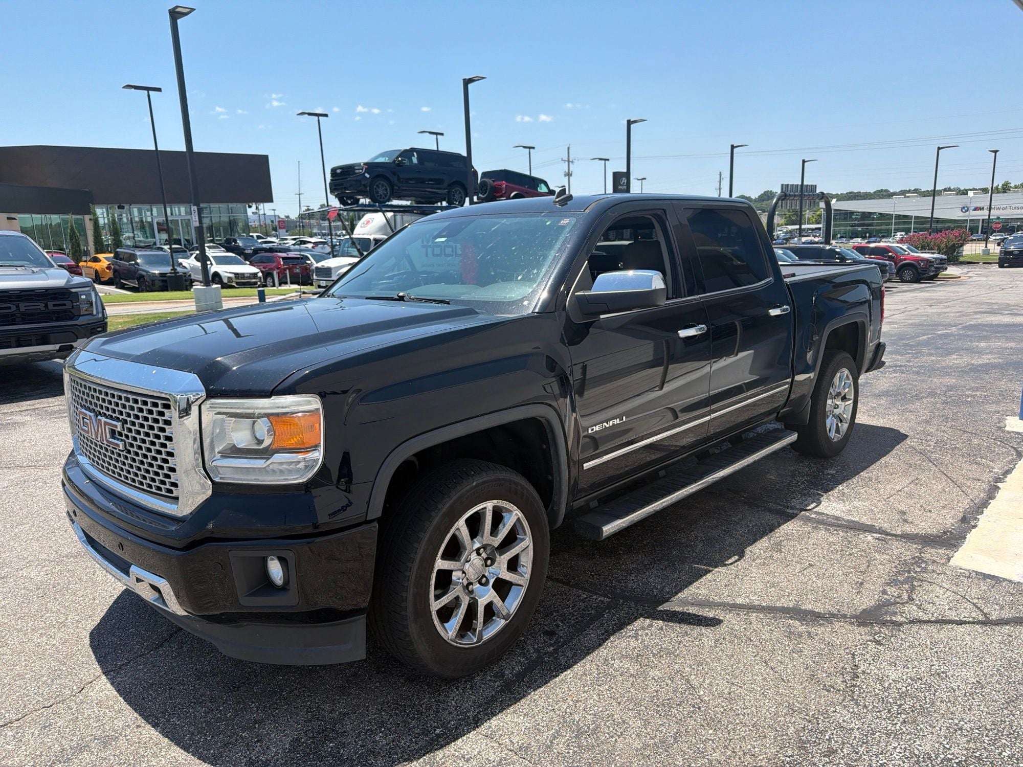 2014 GMC Sierra 1500 Denali in Onyx Black — front three-quarter view