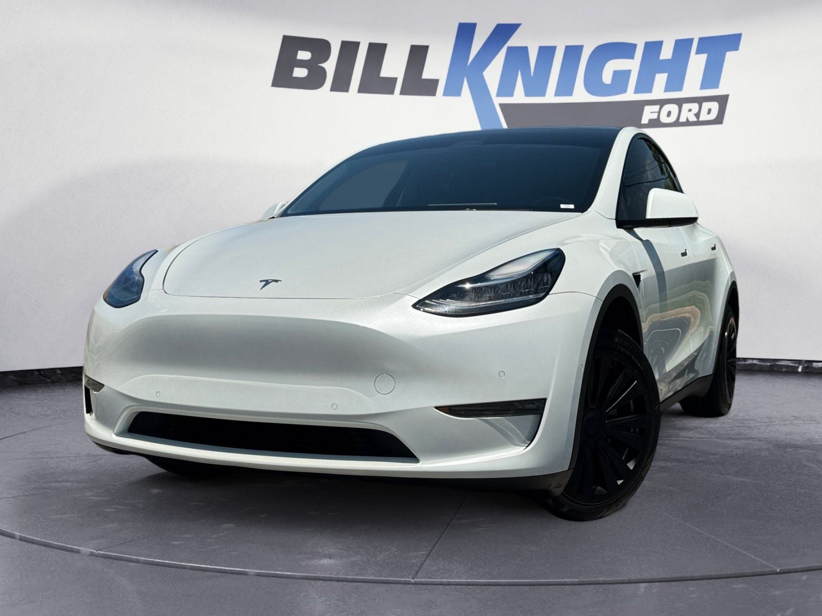 2022 Tesla Model Y Long Range in White — front three-quarter view